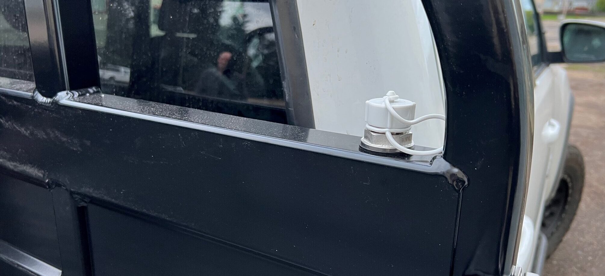 Summit Expedition Trucks water tank fill point mounted near the flatbed
