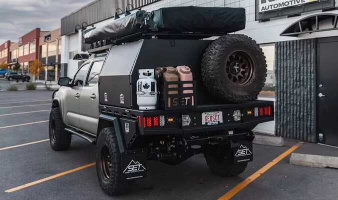 Canopy tire carrier mounted behind a Summit canopy setup